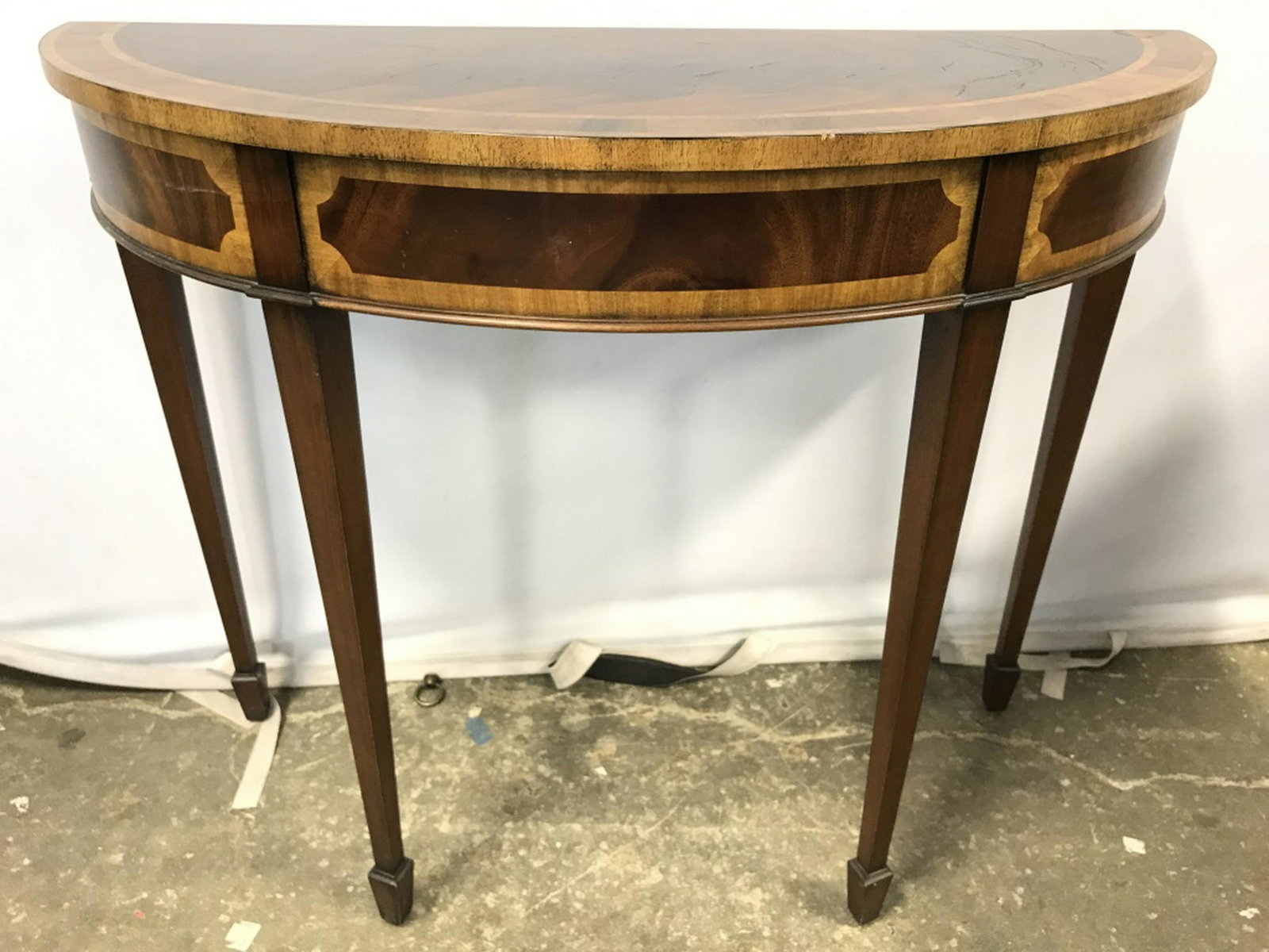 Pair Curved Wooden Console Tables: Lot includes 2 Console Tables. Each have carved wooden detail. Pieces have half oval shape. Console tables, hallway tables, wooden tables. home furnishings and accessories Each measures approx 36 inch