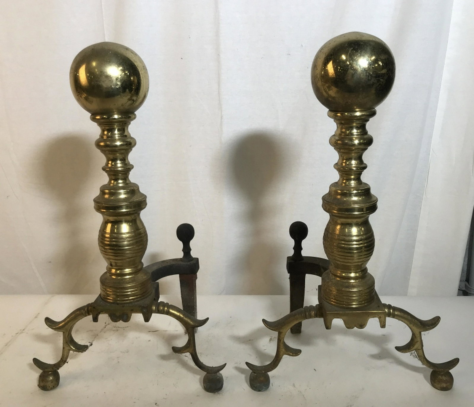 BRASS ANDIRONS: Grand Ball Top Brass Andirons for the fireplace. 12 in. wide, 21.5 in height, possibly polish to shine up if it’s decor. Andirons, Fireplace, Home Fireplace Accessory, Vintage Brass Andirons, Burnin