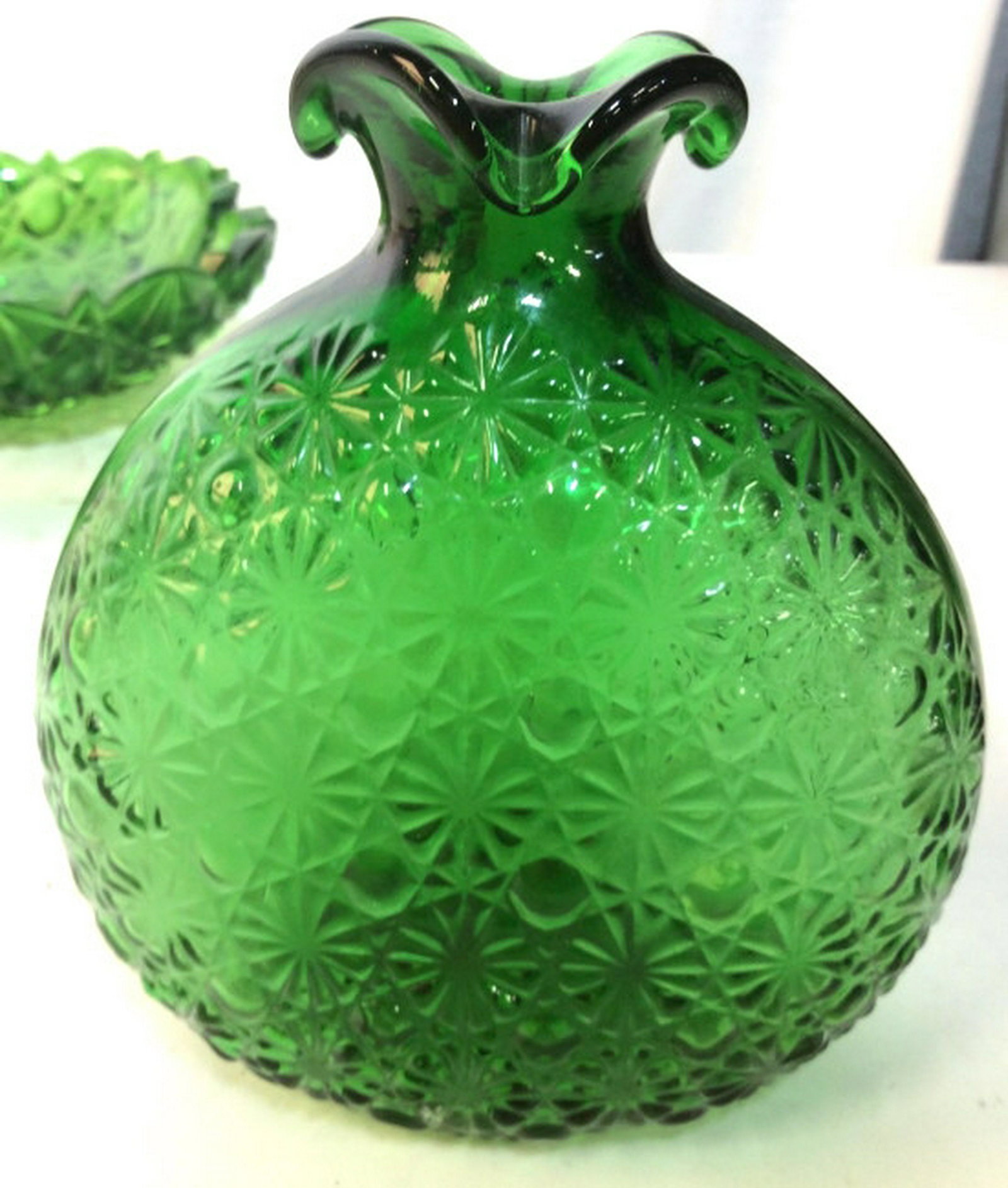 3 Vintage Green Glass Vessels: Bowl measures diameter app 10 inches, glass with raised Daisy motif embellishment as vase decorative accessory, and green hand formed fingers vase, bud vase, tabletop decor and accessories ht app 6 in