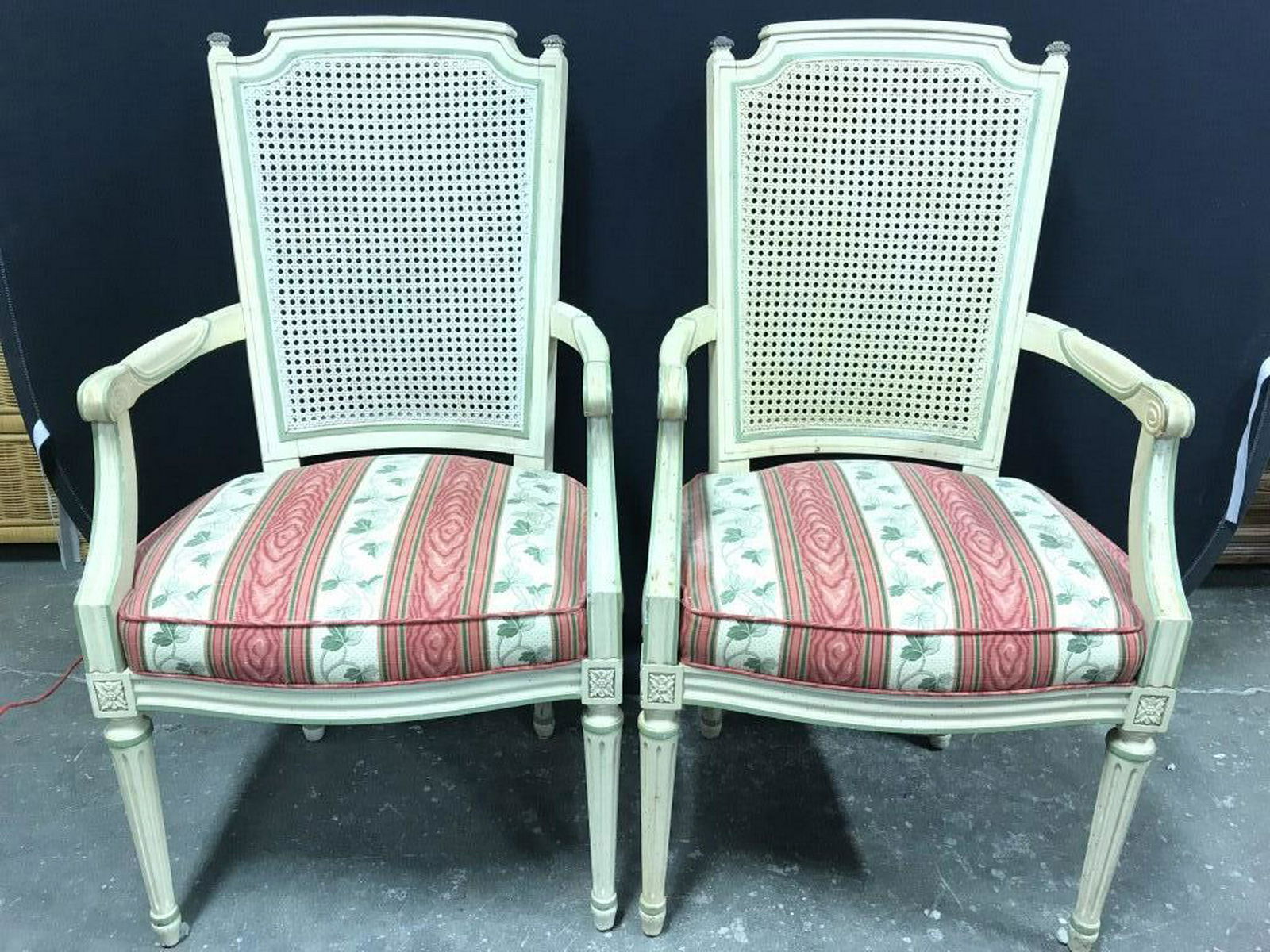 Pair Caned Back End Chairs: Lot includes 2 End chairs. Each have caned back rests. Seats of end chairs have leaf and vine detail. Pieces measure approx 40 inches tall 22 inches wide 25 inches deep. side chairs, dinner chairs, ho