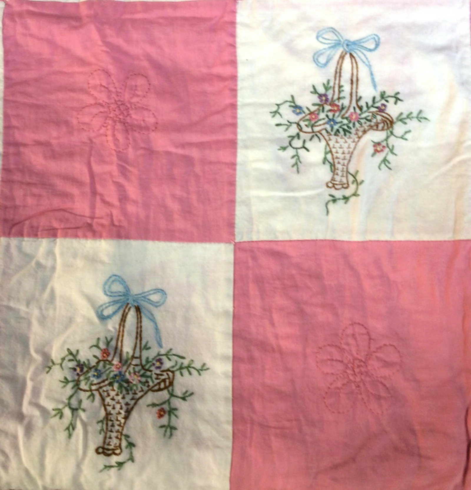 Vintage Hand Embroidered Quilt: Patchwork quilt, home accent and decor, home accessory hand stitched flower basket design, checkerboard pink and white patchwork, measures app 64 inches by 79 inches