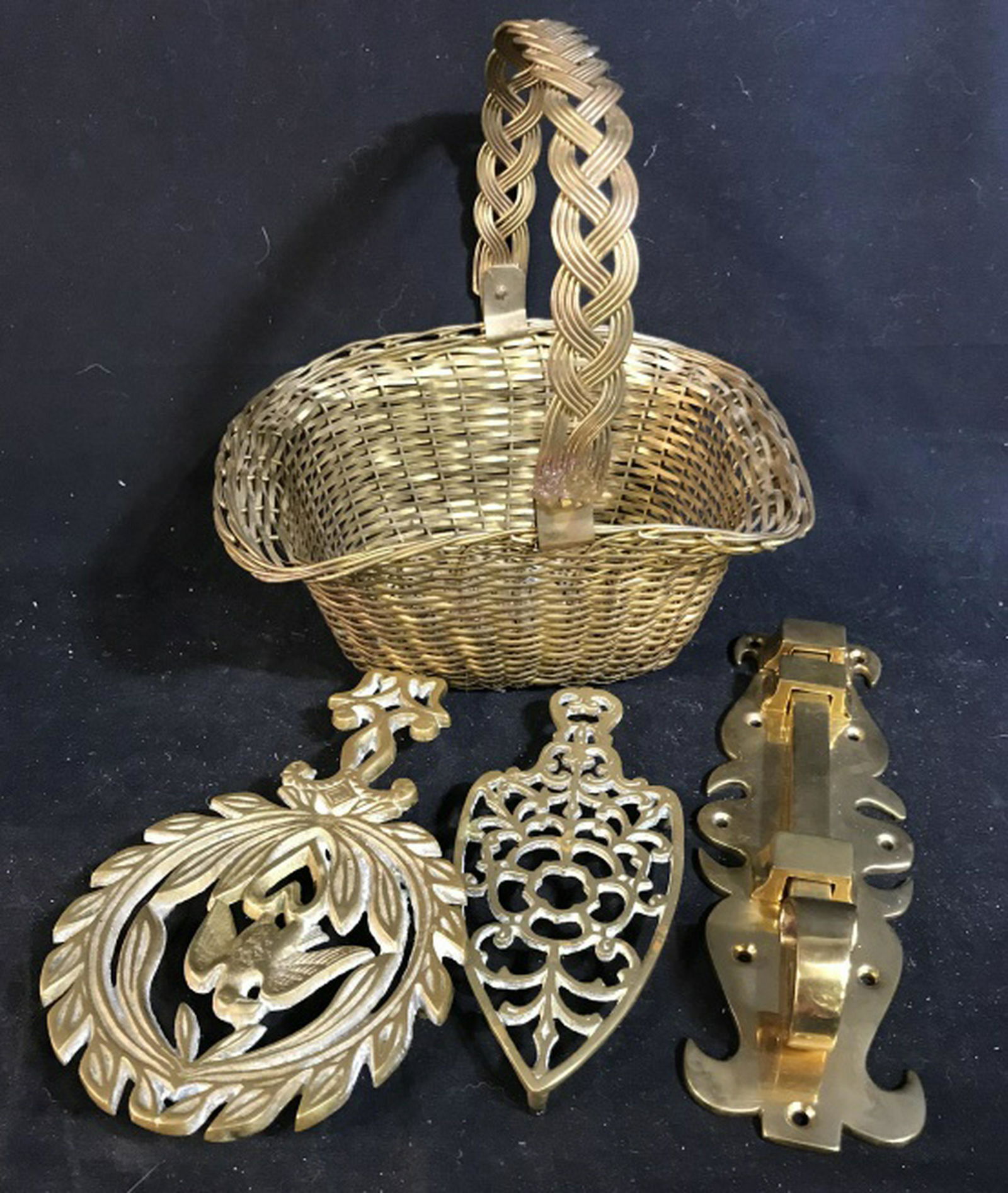 Group Lot Vintage Brass Items: Woven brass basket ht to handle 10 inches, two brass trivets one w center Phoenix, brass door latch length app 11 inches, collectibles, tableware, tabletop accessories