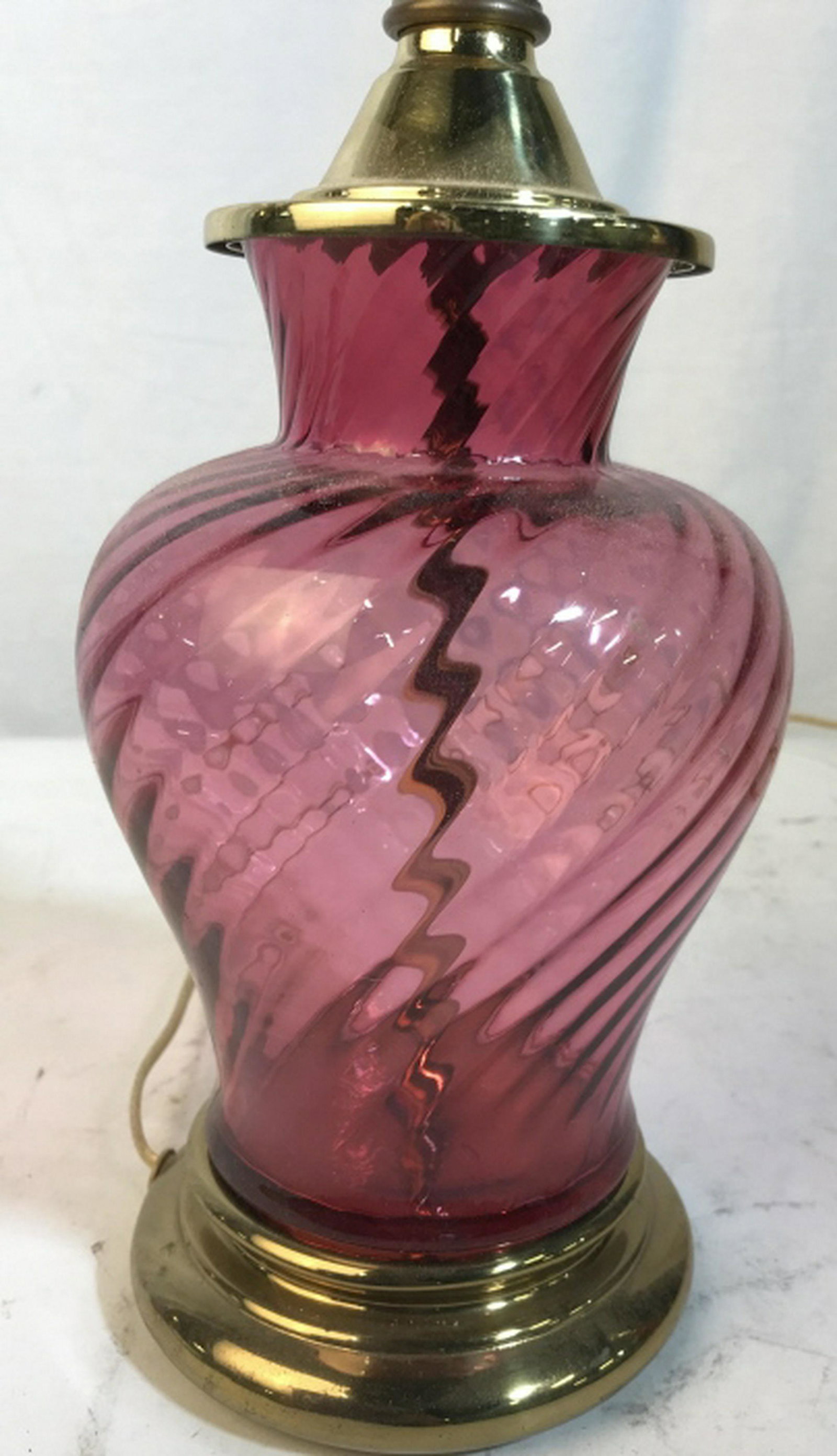 Cranberry Glass w Brass Lamp: Swirl pattern urn form cranberry glass with brass details into lamp, 23 in ht to finial, 7 in in diameter. home accent and decor, lighting accessories, table lamps