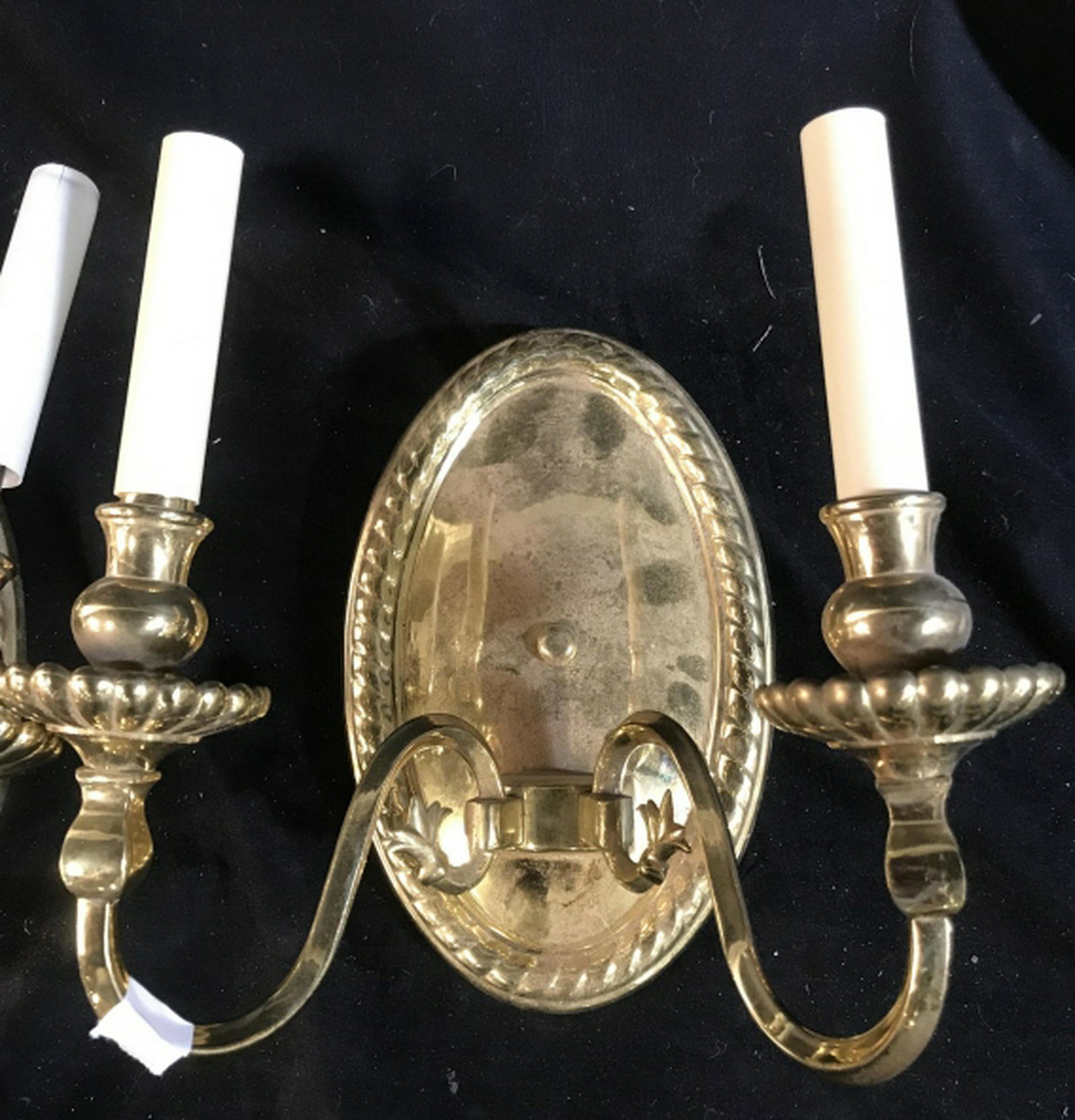 Pair Double Arm Brass Wall Sconces: Each with oval back ht 11 inches, each with two arm candelabra form lights, depth app 7 inches, wall sconces, home decor and accesories