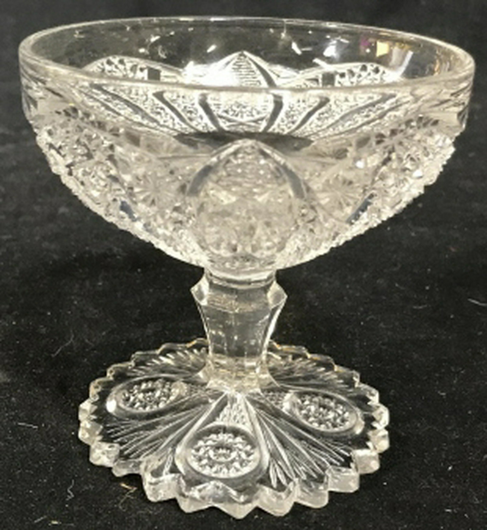 Vintage Drinking Miniature Tazza / candy dish Vintage: Vintage drinking glass. Intricate design. Design marked with geometric floral patterns. Measures approximately 4 inches in height. Vintage glass, glassware, tazza candy dish, tableware, tabletop acces