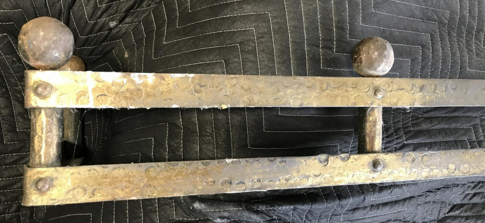 Gold Toned Metal Fireplace Fender Possibly gilt iron,: Possibly gilt iron, possibly brass. Measures approx 6.5 inches in height by 41.5 inches in width by 12 inches in depth. Some surface wear like discoloration. Fireplace accessory, salvaged fender, inte