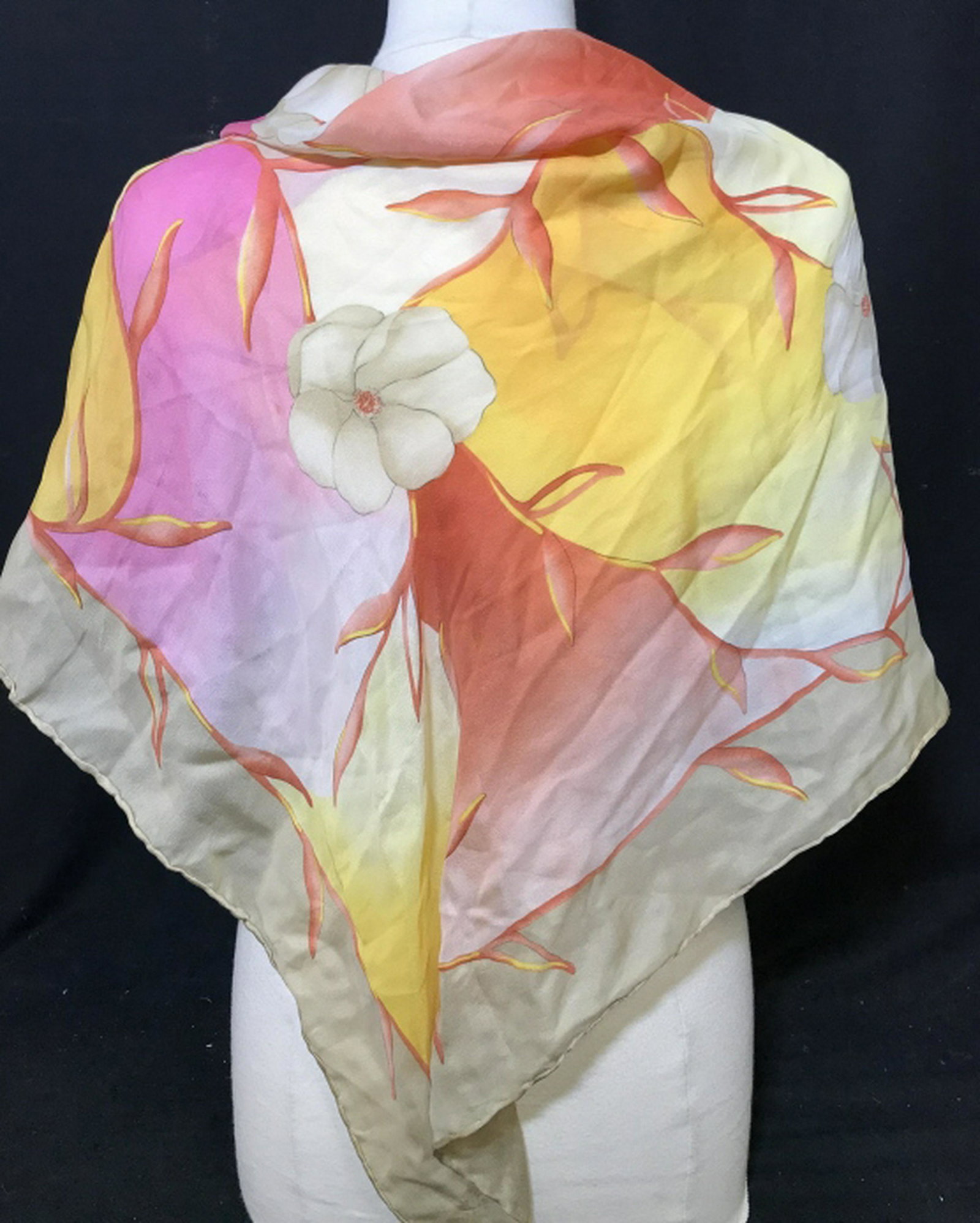 Floral Silk Scarf Warm palate of colors; coral, bright: Warm palate of colors; coral, bright pink, honey beige, orange- yellow hues. No rips or punctures, very slight fabric pull, possibly from machinery. No noticeable surface marks. Approx 34.5 x 34.5 in.