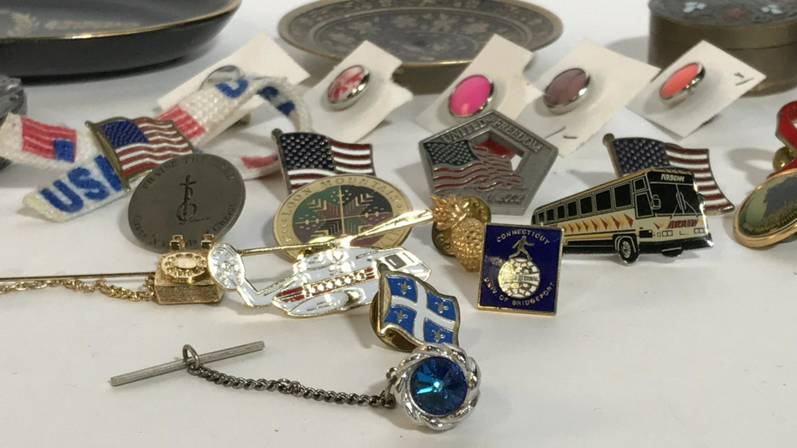 Lot 25 Patriotic Pins, Lapel Pins & More Boxes: Boxes Assortment- Pins include American Flags, 9/11 Freedom Pin, Helicopter, MADD, Pineapple, Telephone, New Hampshire pins, Religious Pins & Natural Stone - Type Pins. Two Trinket Dishes & Two Trinke