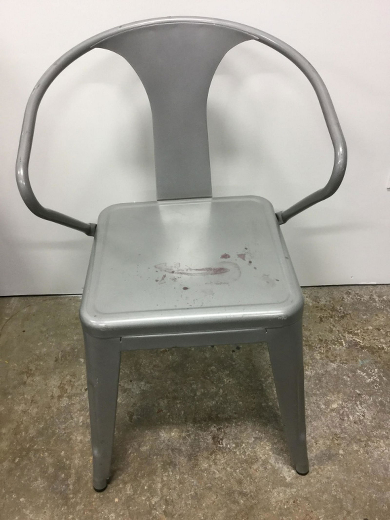 Silver Tone Metal Chair Silver tone metal chair. Chair: Silver tone metal chair. Chair has surface wear like blemishes, might need cleaning or restoration. Measures approx 31 inches in height by 20 inches in width by 16 inches in depth. Metal chair, dining