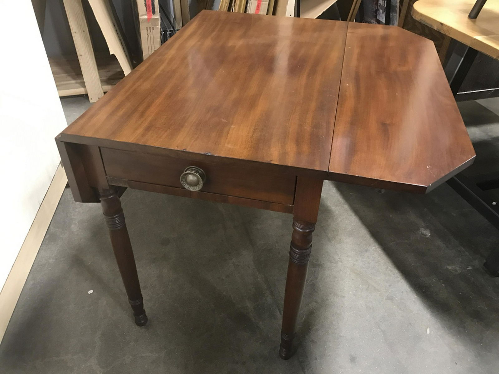Vintage Wood Drop-Leaf Pembroke Table pembroke table,: pembroke table, Vintage wooden drop leaf table with center drawer. Table extends from a rectangular shape to an octagonal shape. Measures approx 36 inches by 22 inches in length and width, 29 inches i