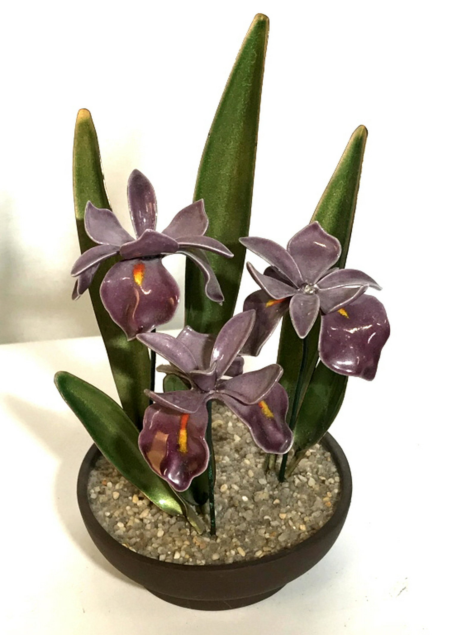 Handcrafted BOVANO of Cheshire Natural Art Metal with: Metal with enamel, sculptural art, iris flowers BOVANO Of Cheshire is classic craftsmanship from designer Perry Marshall. Includes leaflet on Perry Marshall and his past work. This piece is vintage 19