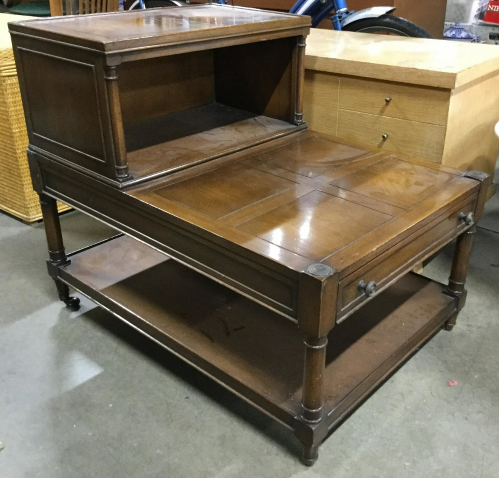 Vintage Wooden Bi Level Side Table Side table has 1: Side table has 1 drawer with knob style metal handles. Piece has small upper level and large lower level. Piece measures approx 30 inches long 25 inches tall 20 inches deep. Home accent and furnishing
