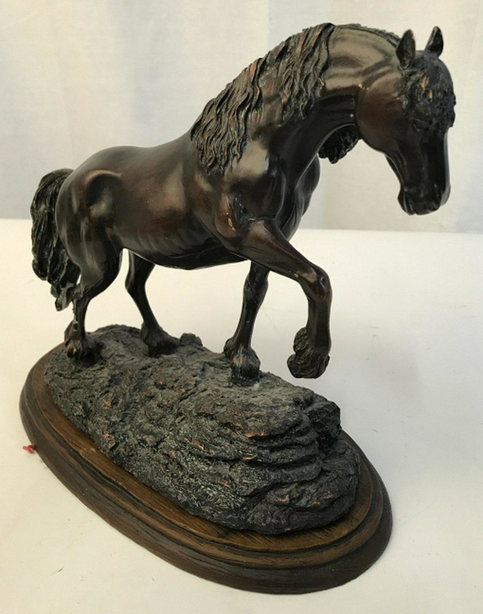 HAND PAINTED HORSE STATUE Hand painted horse statue.: Hand painted horse statue. Appear to be composite material. Rear is cracked. Stands at approximately 9 inches tall. Length is approximately 10 inches long. Made in China. Home accent and decor, shelf 