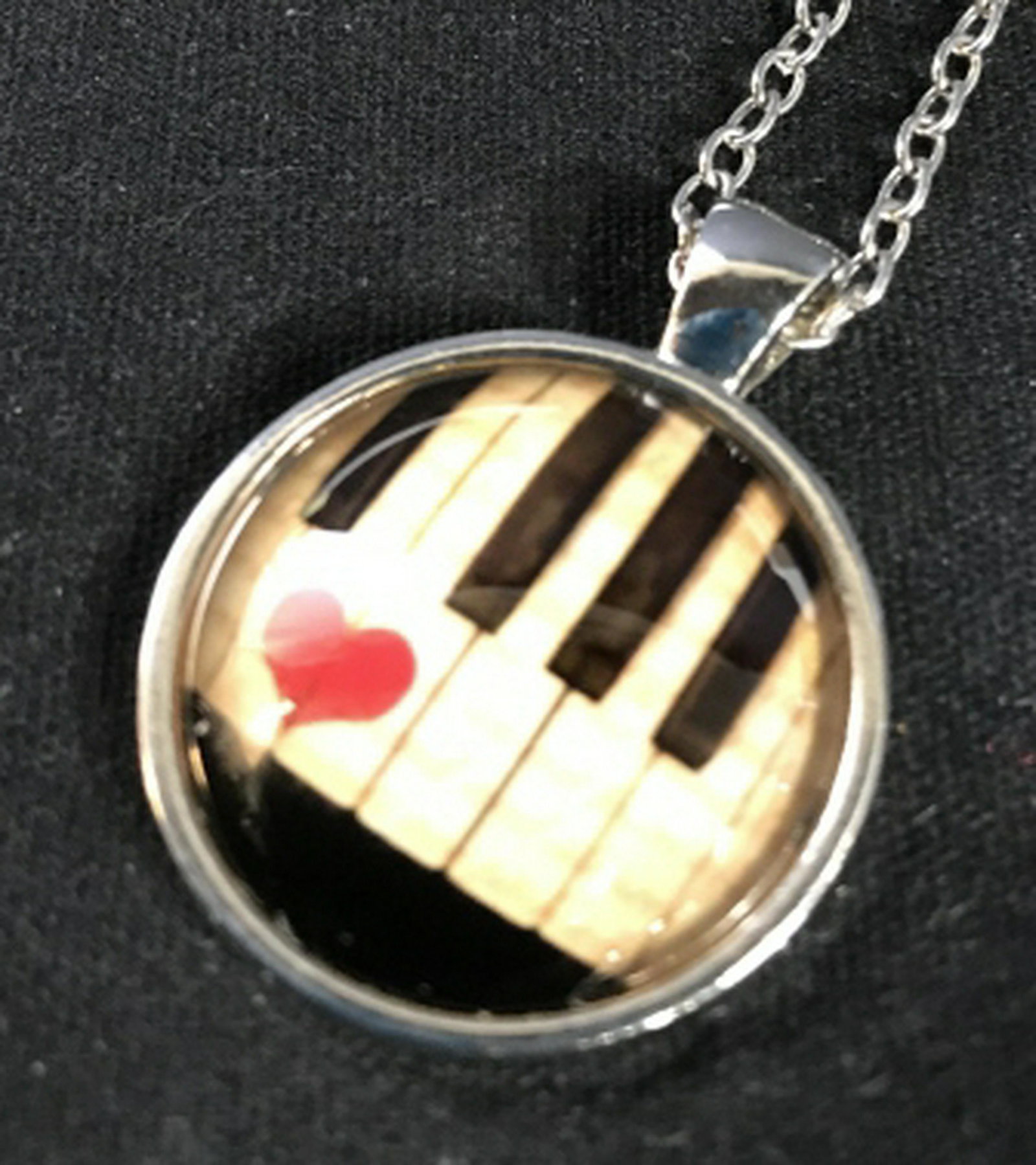 Music Theme Pendant Necklace In silver toned setting,: In silver toned setting, circular pendant depicting piano keys with heart, silver toned chain, pendant diameter app 1 inches Fashion accessory, wearables, women's vintage costume estate jewelry