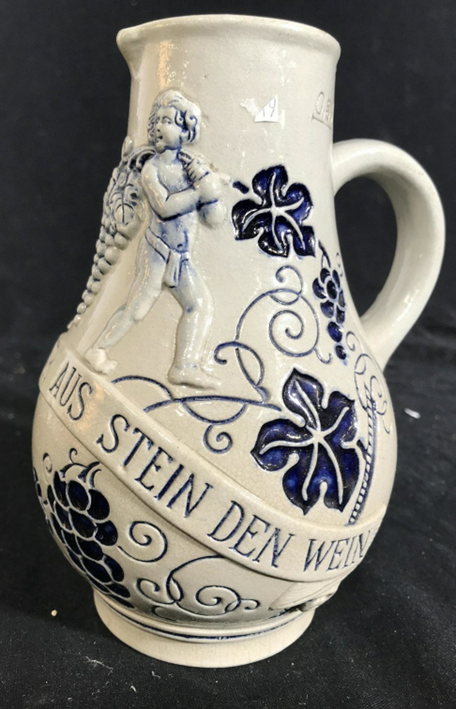 Ceramic Jug with Grapes and Cupid’s , Germany Made in: Made in Germany, Jug Pitcher, Vase, Vessel, with relief of grapes and puttis, angels, Cupid’s, Measures app 6.5 inches ht, tableware, pitcher jug, ceramic pottery, shelf piece, decorative tableware 