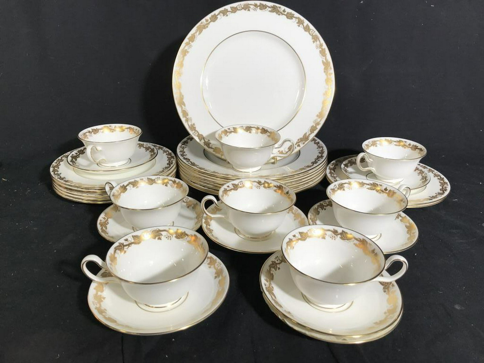 WEDGWOOD White Hall Porcelain Dinner Service for 8: English Porcelain place settings, marked underside Wedgwood, white porcelain with gold leaf grape and vine borders, 8 dinner plates diameter 10.5 inches, 8 lunch plates diameter 8 inches, 8 cups and 8