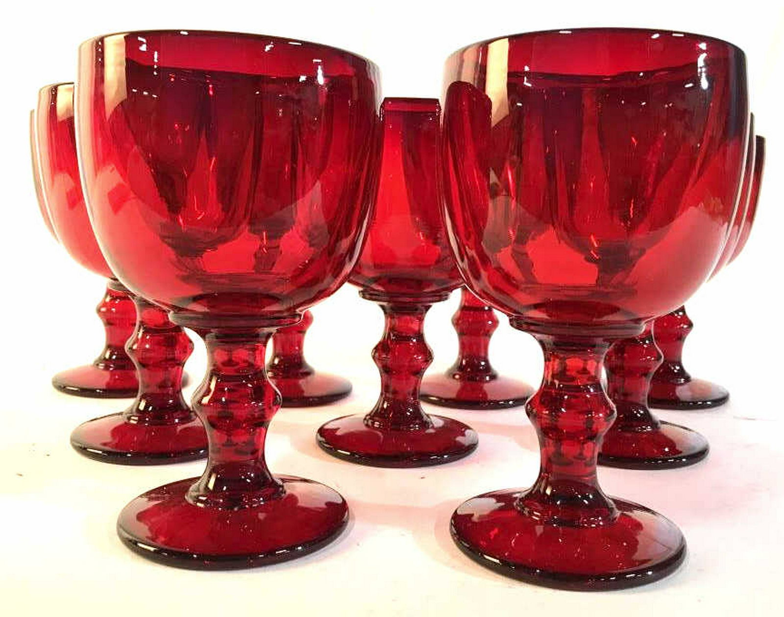 Heavy Cut Red Glass Goblets , 9 Set 9 red heavy glass: Set 9 red heavy glass Stemware, glass ware, table ware, each hand formed each Measures ht 6.5 inches diameter app 4 inches, festive table top accessories