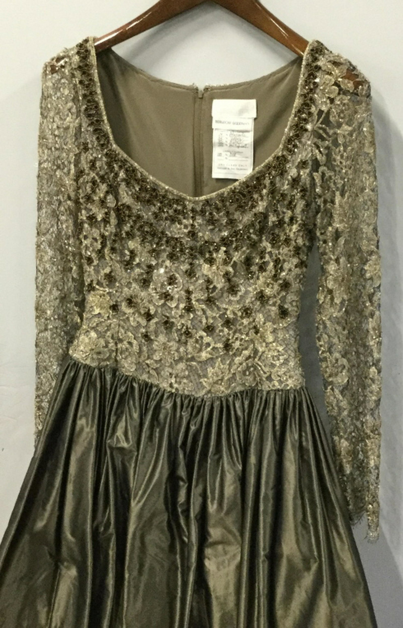 BADGLEY MISCHKA Taffeta Silk Beaded Dress Dress made: Dress made for Bergdorf Goodman by BADGLEY MISCHKA. Shiny Moss Green Taffeta Bottom with tulle & silk linings. Top is Beaded. Sleeves are see through. Wide scoop neck. Back of dress bottom has some di