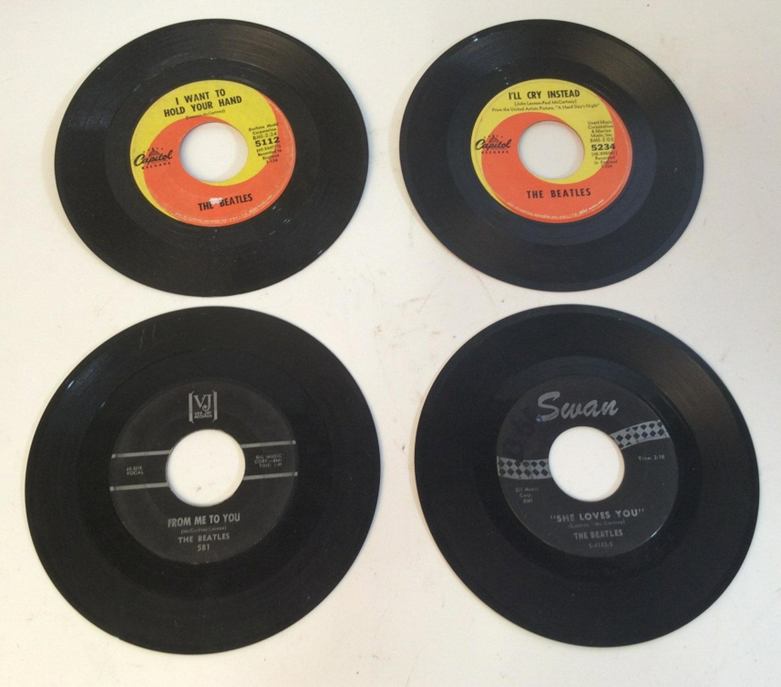 Vintage 7 inch The Beatles records Vintage 7 inch The: Vintage 7 inch The Beatles records. Records for “I want to gol your hand”, “I’ll cry instead”, “from me to you”, and “she loves you”. Without case 5 Records, old records, vintage rec