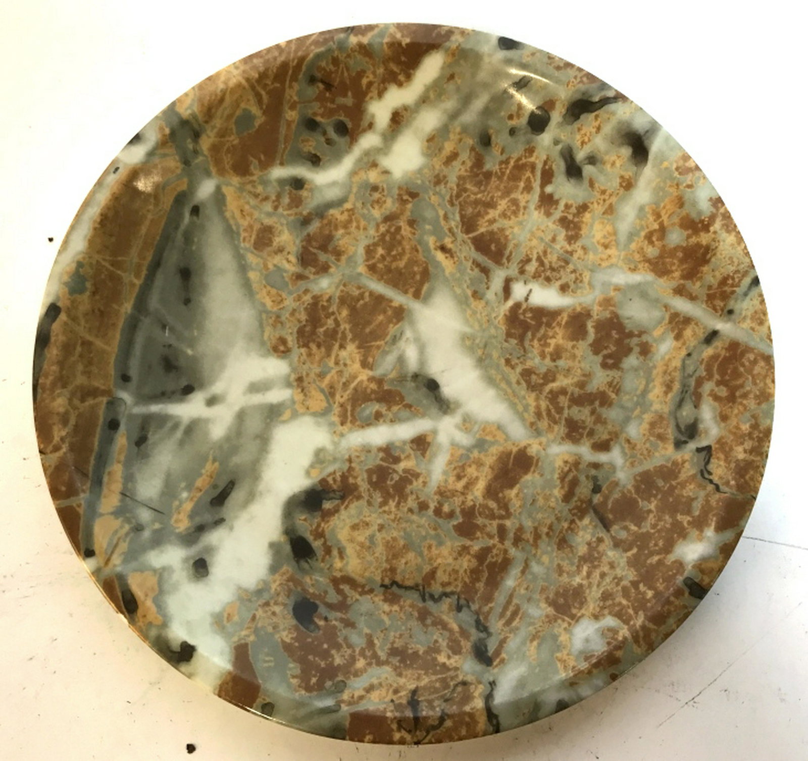 Natural Stone Plate Made for Bergdorf Goodman Plate was: Plate was made in France and is carved from multi colored natural stone. Measures 9 1/4 in. Marked on underside. Possibly surface scratches visible from certain angles. No nicks or chips. Use as decor