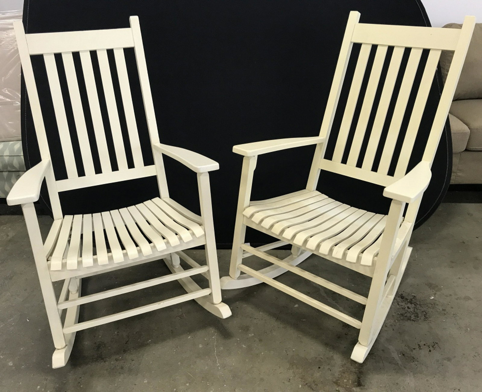 Pair Painted Wooden Rocking Chairs Rocking chairs are: Rocking chairs are pale yellow / cream in tone. Each measures approx 43.5 inches in height by 26 inches in width by 33 inches in depth. Some surface wear like discoloration and minor scuffs. Vintage w