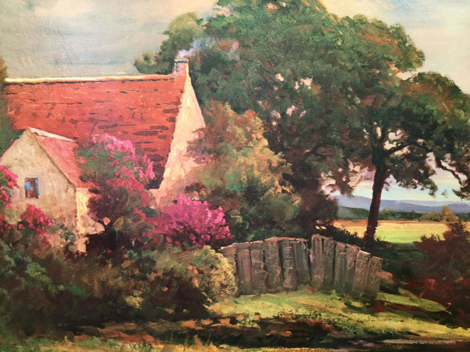 Framed Print On Cardboard, Cottage in Landscape: Cardboard is set in wood style frame. Measures approx 15.5 inches in height by 27.25 inches in width with frame. Board has some warping, might need flattening. Robert Wood signature in print in lower