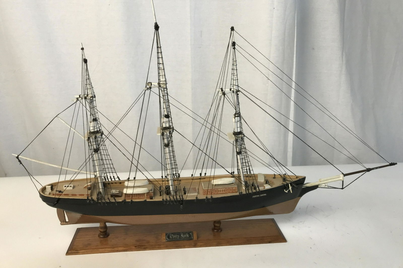 CUTTY SARK model ship vessel wood Decorative vessel: Decorative vessel made out of wood and string. No sails. Small detailing on ship. Mounted on wood. Max length is approximately 25 inches and max height is approximately 17 inches. Nautical vessel, nau