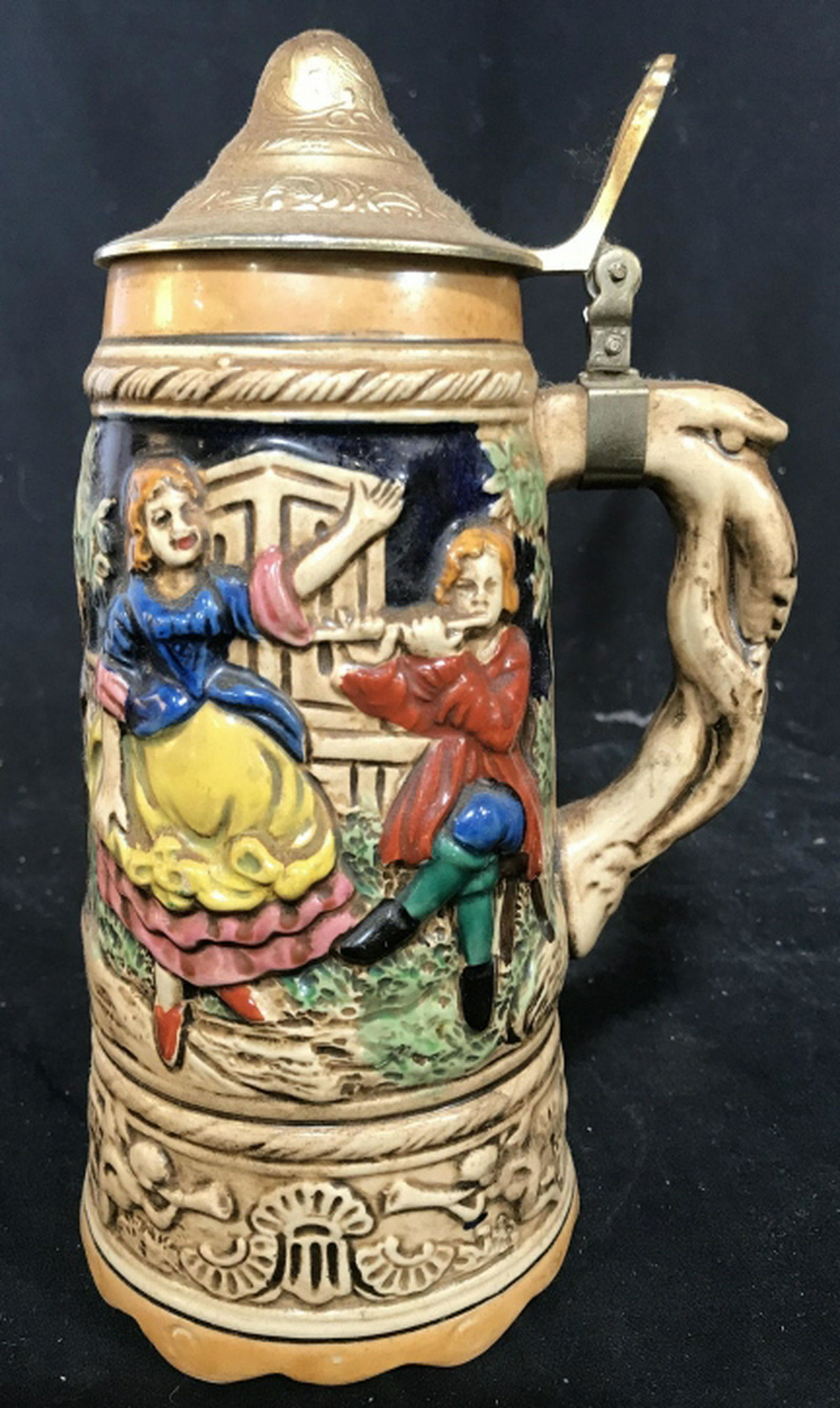 Lidded Ceramic German Beer Stein With dancing Figurals: With dancing Figurals in Relief, celebration theme measures ht app 10 inches. beer stein drinking mug, collectible stein, home accessory