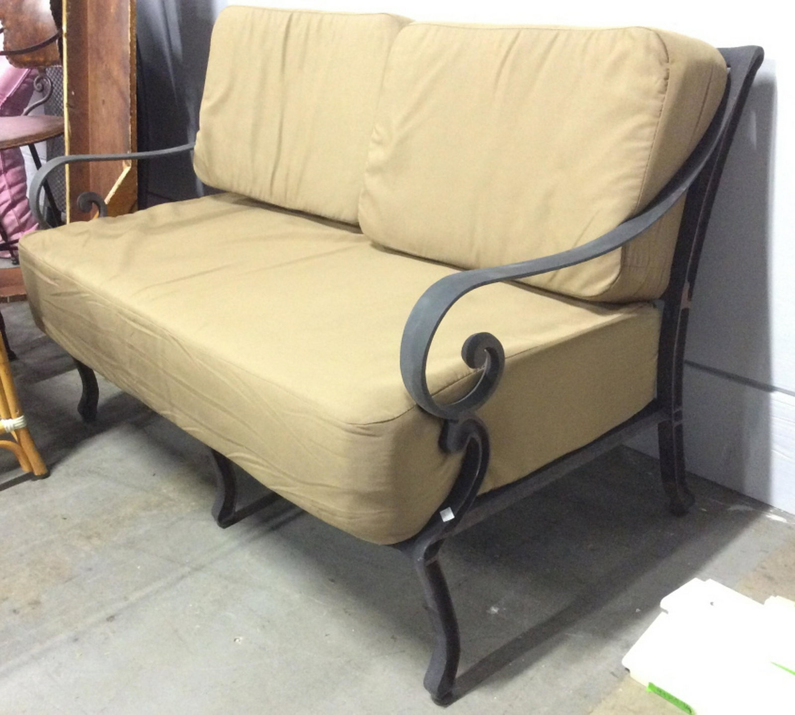 Outdoor Metal Loveseat W Cushions Pieces black Toned: Pieces black Toned And Metal. Piece contains 1 large seat cushion and 2 backrest cushions. Armrests have c curve detail. cushions have a light brown tone. Piece measures approximately 54 inches long 3