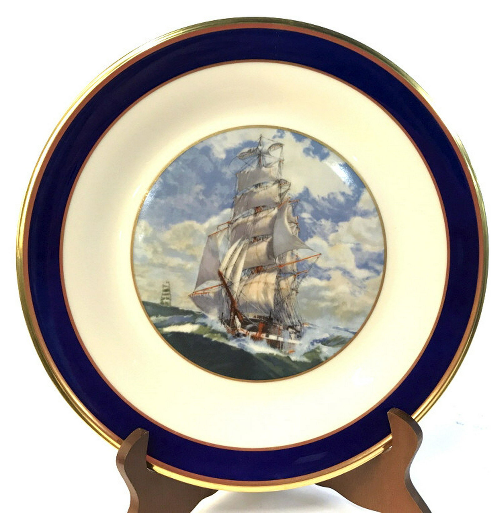Porcelain Lenox Nautical Display Plate Nautical: Nautical porcelain plate with sailing ship pictured. Blue border with gold colored rim. Measures approximately 10.5 inches in diameter. Back marked by Lenox Company. Porcelain plate, nautical porcelai