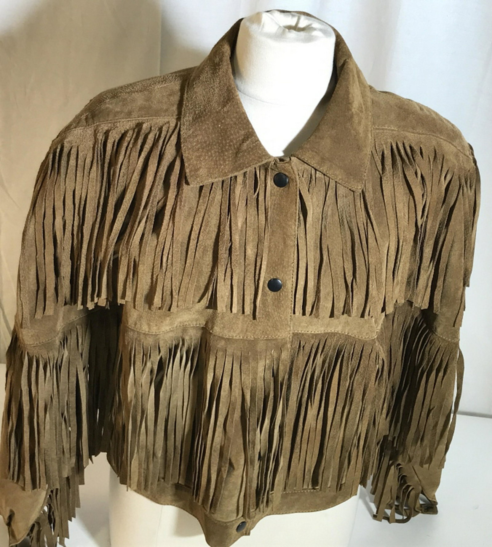 Toffee Colored Suede Tassel Jacket Suede Cowboy Outer: Suede Cowboy Outer Jacket In size L. Snap front buttons, fully lined. No exterior or interior marks, stains, rips, kinks in material. Fairly heavy. Fashion Jacket, Suede Jacket, Cowboy Style Jacket, H