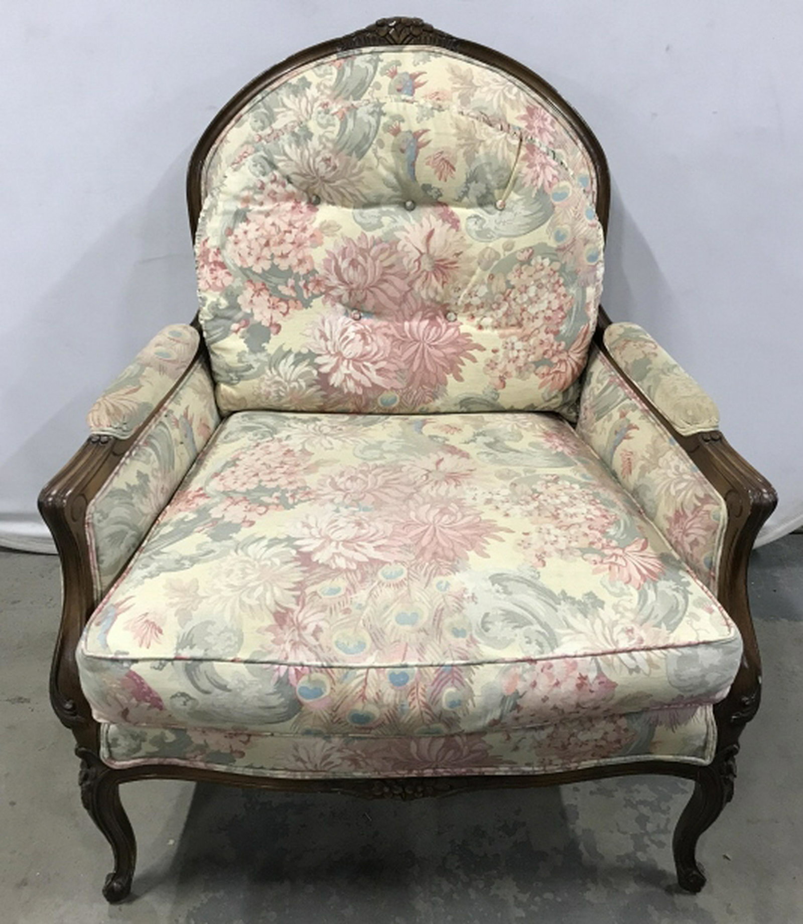 Bergere Style Armchair W Custom Upholstery Oversized: Oversized Bergere Style Lounge armchair with floral custom upholstery. Lot includes roll of extra fabric. Chair frame is carved wood with carved floral accent details. Measures approx 41.25 inches in 