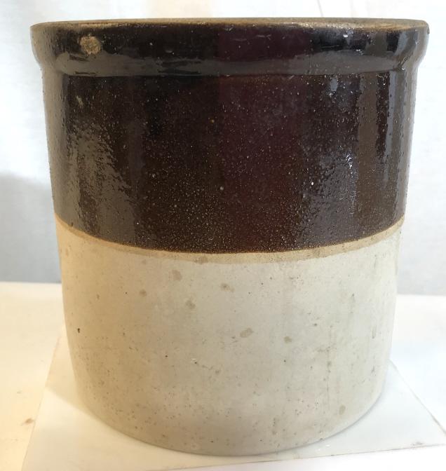 Split tone ceramic planter Multi tone brown planter.: Multi tone brown planter. Some chipping evident at the top. Stands at approximately 7.5 inches tall and is around 7.5 inches in diameter. May be signed on the bottom, writing is illegible. Ceramic pla