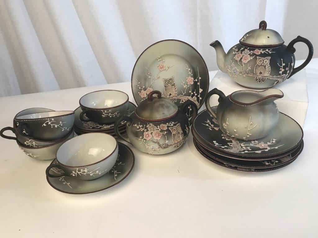18-Pc Nippon Japan Owl Moriage Tea Service: 18 piece Japanese Nippon Owl Moriage Porcelain Tea Service dishware Set. Lot includes 1 teapot, 1 Lidded sugar bowl, 5 bread plates, 1 cream Pitcher, 5 tea cups, 5 Saucers. Largest item, the teapot, m