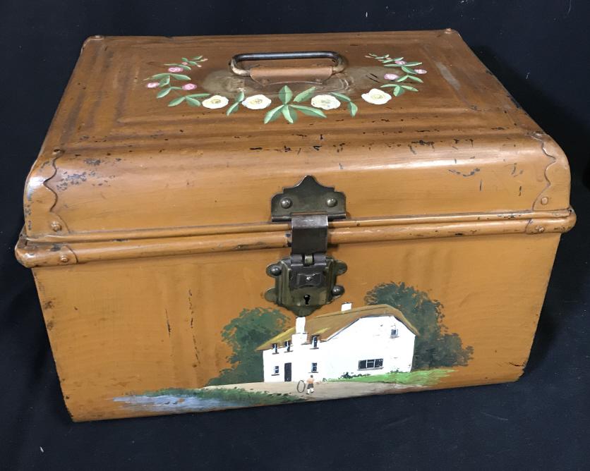 Vintage Hand Painted Metal Storage Box: Possibly European. Orange rust color paint with Dutch farm house on a country road. Old fashioned key lock with hinge clasp to open. No key but hardware is in good condition. Carry handle on top and s