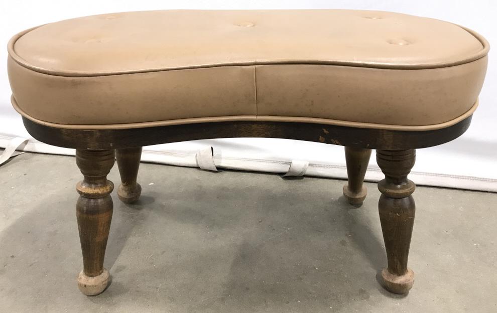 Leather Footrest W Carved Wooden Legs Foot stool had: Foot stool had bean shape. Piece contains carved wooden legs. Footstool has bean shape. Piece is vintage. Measures approx 22 inches long 14 inches tall 12 inches deep. foot stool, foot rest, home acce