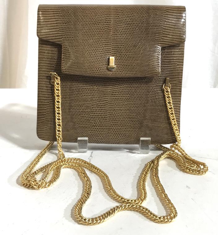 Genuine Lizard Shoulder Chain Purse: Lizard Purse Made in France for Bonwit Teller. Marked on underside of flap. Gold tone shoulder chain & hardware. Purse measures 7.1/4 x 7 1/4 x 1 3/4 in. Double chain, hangs 13 in. Snap closure. Chain