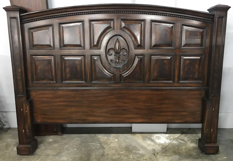 Grand Oversized Wooden Fleur de Lis Bed Frame: Lot includes headboard, footboard, 2 side panels, and 3 underbed support panels. Oversized arched headboard with panel pattern and center carved fleur de lis motif. Glossy, dark tone wood, possibly ma