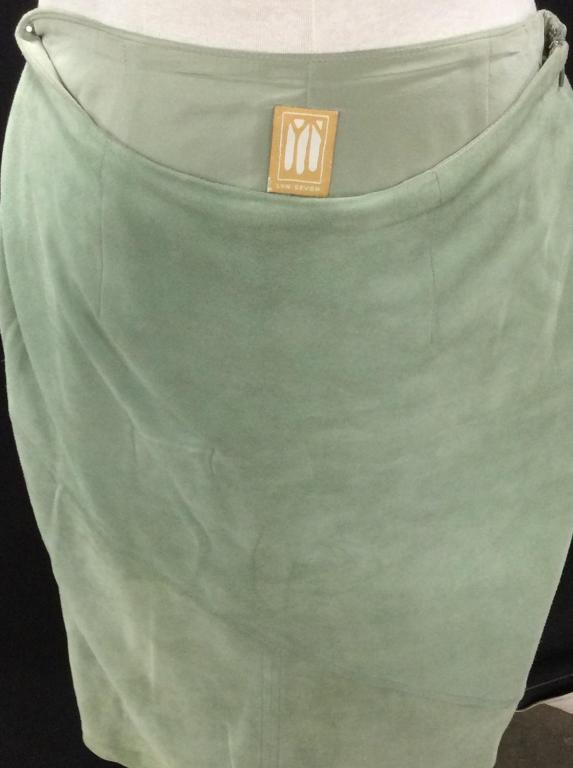 DESIGNER LYN DEVON SUEDE SKIRT: Light Green Suede skirt, size S, Lined, lightweight fabric. Skirt length, 21 in. Waist, 30. Sewn in Creative Pattern. Lyn Devon designed women's ready to wear for Ralph Lauren before launching her own