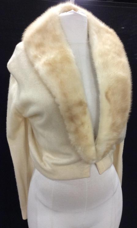 Vintage Fur Collar Petite Sweater Jacket: Blond Fur On Collar and lapel. Can be removed, snaps on. Possibly cashmere. Cuffs adorned with pearlescent buttons. Taper at wrists. Interior lined, but not in arms. Vintage 50s sweater. 19 in. Sleeve