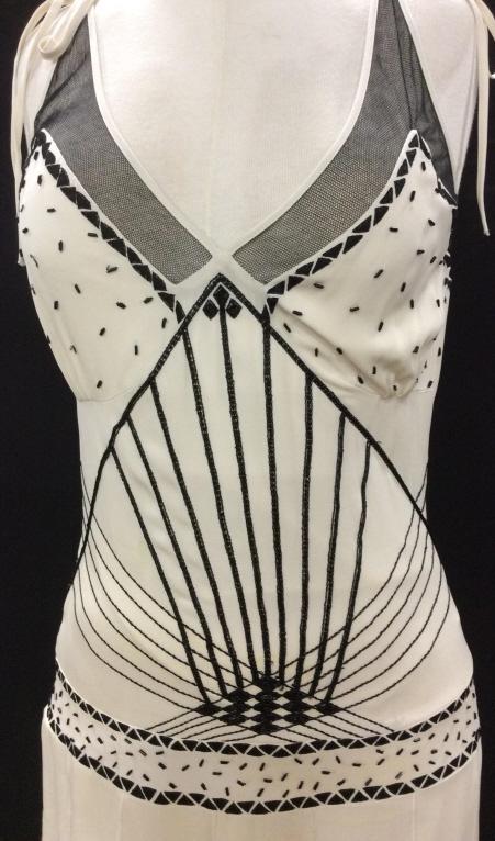 ART DECO NICOLE MILLER COLLECTION FLAPPER DRESS: 100% Silk Dress by Luxury Designer Nicole Miller. size 4. Straps adjustable. Intricate Geometrical Beading On torso and breast. Bottom layered in strips of fabric. Lined Poly. Needs cleaning, a few be