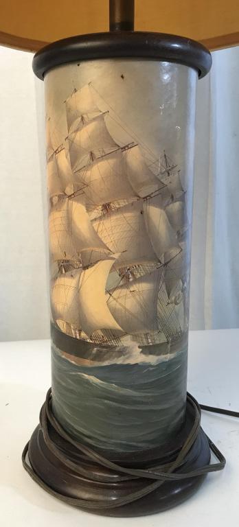 Tall nautical lamp with shade: Stands approximately 30 inches in max height and 14 inches in max width. Small rip on imaged portion of the lamp. Lampshade is approximately 14 inches tall. Brown lampshade. table lamp. Nautical lamp,