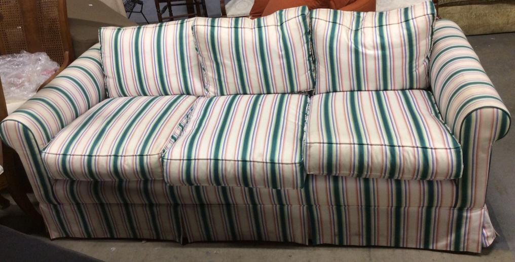 Striped Skirted Sofa: Sofa has striped detail with tones of pink, blue, cream & green. Sofa is Skirted. Measures approx 79 inches long , 33 inches tall, 39 inches deep. Contains some wear & stains. sofa, couch, home furnis