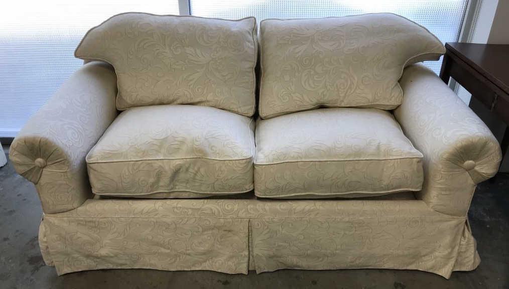 Vintage Upholstered & Skirted Couch: Couch has white and cream tone fabric upholstery with leaf pattern. Measures approx 30 inches in height by 72 inches in width by 38 inches in depth. Some surface wear like blemishes in fabric, might n