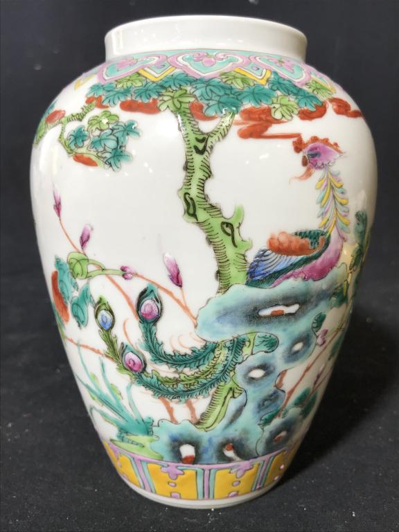 Asian Porcelain Vase: Vase is white toned with intricately painted detail. Piece is possibly hand painted. Measures approx 7 inches tall 5 inches wide. Vase, ginger jar, porcelain vase, porcelain ginger jar. asian arts and