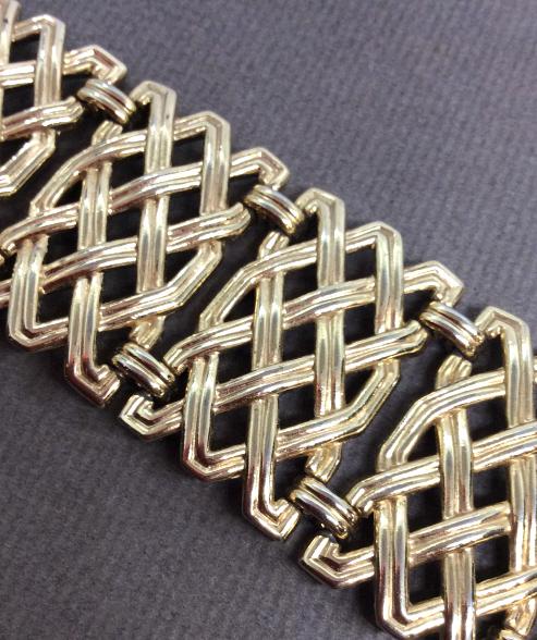 TRIFARI Woven Style Bracelet: Trifari Bracelet. Woven style links in gold toned metal, Measures approx 8 IN long from end to end. Ladies estate designer costume jewelry, costume Statement jewelry, fashion accessories, wearable acc