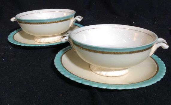 Set 2 MONTICELLO DINNERWARE BOWLS AND PLATES: Set contains 2 bowls and 2 plates. Cups have 2 handles. Plates measure approximately 6 inches in diameter. Bowls and plates have a mint green and gold colored outer rim. Each piece of Dishware has Mon
