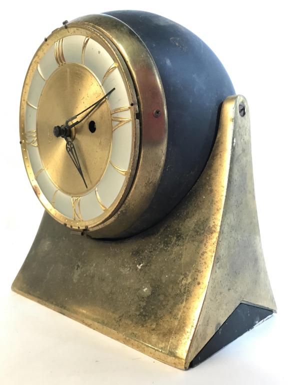 Vintage WESTWOOD 8 DAY German Clock: Piece is marked WESTWOOD 8 DAY. Piece appears to be brass and metal. Clock has spherical shape. Piece rotates on a vertical axis. Measures approx 8.5 inches tall 7 inches wide. Piece vintage, has wear