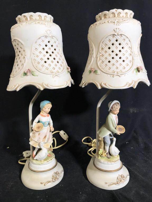 Lot 2 Child Figural Lamp: Lamps are bisque style porcelain. One depicts a female child Figural the other depicts a male child Figural. Each measures approx 19 inches tall 7.5 inches wide. table lamps, home accent and accessori