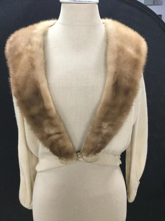Vintage Mink Collar Cropped Cashmere Sweater: Medium Blond Fur On Collar and lapel. Can be removed, snaps on. Sweater fabric, cashmere. Cuffs adorned with double buttons. Taper at wrists. Interior lined, but not in arms. Hook and loop closure at